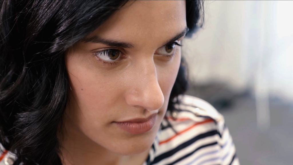 Close-up of a young woman in a drama video